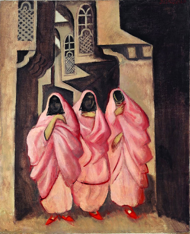 three women on a street of bagdad